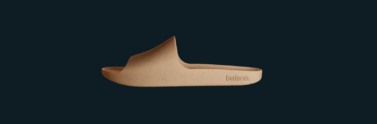Beige sandals on navy blue background