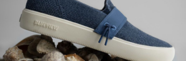 A single blue shoe on rocks