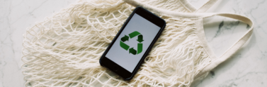 mobile-phone-with-green-recycling-sign-and-mesh-bag