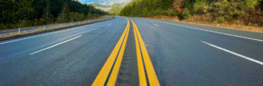 ground-level-view-of-wooded-highway