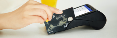 Person-swiping-bank-card-in-machine