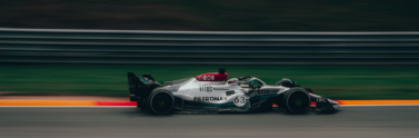 time-lapse-photography-of-green-and-white-racing-vehicle-on-lane