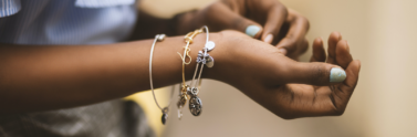 selective-focus-photography-of-person-wearing-three-bangles