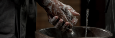 person-washing-hands-with-soap