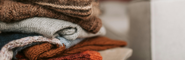 close-up-photo-of-folded-knitted-sweaters