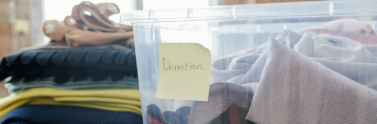 clothes-in-a-plastic-box-for-donation