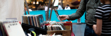 -people-standing-in-front-of-vinyl-records