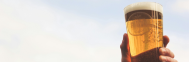 person-holding-glass-of-beer