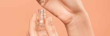 person-holding-serum-bottle