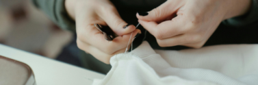 person-repairing-garment