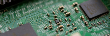 tilt-shift-photography-of-green-computer-motherboard