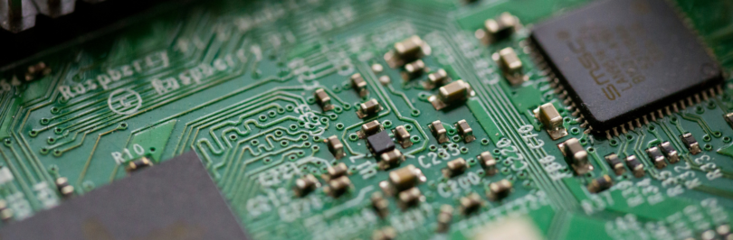 tilt-shift-photography-of-green-computer-motherboard