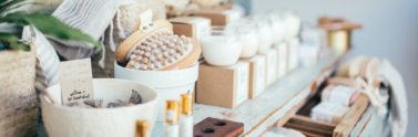 perfume-placed-near-bath-brushes-and-aromatic-candles