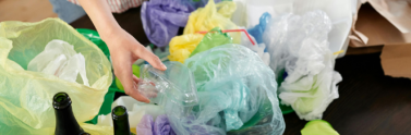 person-sorting-plastic-wastes