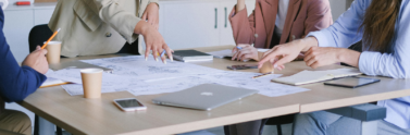 people collaborating in a board room.