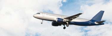 Airplane flying in sky with clouds