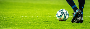 Person on field playing with soccer ballPerson on field playing with soccer ball