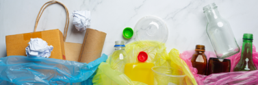 Recycling sorted by type in three different plastic bags