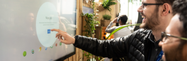 people pointing at screen