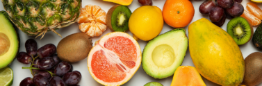 Assorted colourful fruit on white background