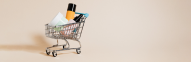 Empty beauty products in mini shopping cart