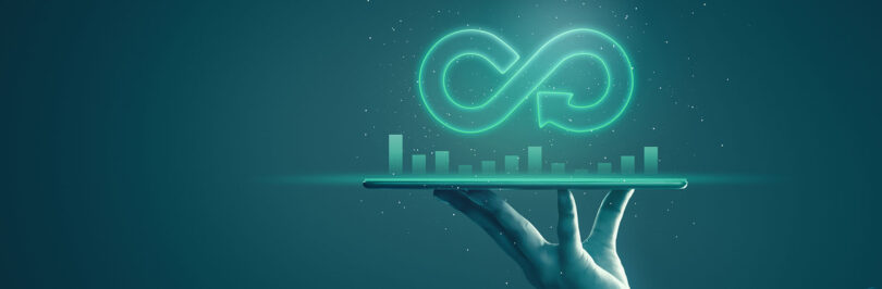 image of a hand holding a growth chart with an infinity symbol above