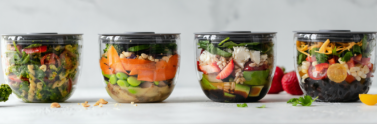 4 reusable food containers on a counter