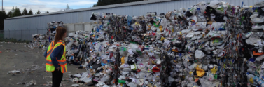 person at recycling depot